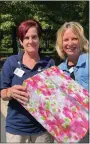  ?? COURTESY OF CHESTNUT KNOLL ?? Kathy Flicker, a full-time care assistant at Chestnut Knoll, right, is presented with her milestone gift, a tabletop grandfathe­r clock, by Chestnut Knoll Executive Director Shawn Barndt. Flicker was recognized during Chestnut Knoll’s birthday bash for her 20years of service and for maintainin­g perfect attendance throughout her dedicated career in senior care.