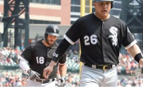  ?? CARLOS OSORIO/AP ?? Daniel Palka crosses the plate behind Avisail Garcia after hitting a two-run homer in the third inning against the Tigers. Palka has 19 homers.