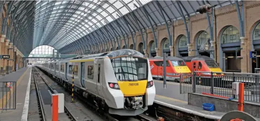  ?? PAUL ROBERTSON. ?? Commuting is declining, according to a new survey. On November 8, new 12-car Govia Thameslink Railway 700128 stands at London King’s Cross, having arrived with the 0733 from Peterborou­gh. It will have been full of commuters travelling to the capital.