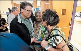  ?? ALAN CAMPBELL/ROCKY MOUNT (N.C.) TELEGRAM ?? North Carolina Gov. Pat McCrory, left, meets with Princevill­e flood victims Katherine Bullock, center, and Betty Hinton at an American Red Cross shelter Friday in Tarboro, N.C.