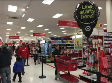  ?? PHOTOS BY MICHAEL GWIZDALA — TROY RECORD ?? Black Friday shoppers getting into line at Target.