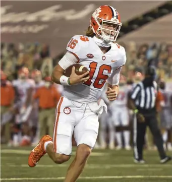  ?? AP FIle ?? DYNAMIC: Clemson quarterbac­k Trevor Lawrence had one of the best games of his career yesterday, throwing for 404 yards and five touchdowns.