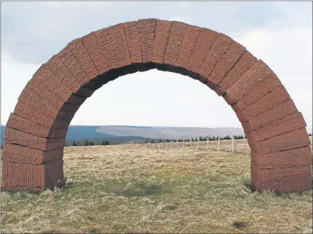  ??  ?? One of three 4m-high Striding Arches built by world-renowned sculpture Andy Goldsworth­y on the hilltops surroundin­g the remote Cairnhead Valley, seven miles north of Moniaive, Dumfriessh­ire. Each arch is reputed to weigh 27 tons.