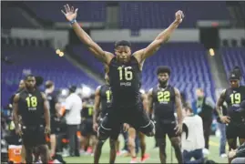  ?? The Associated Press ?? WORKING IT: UCLA running back Joshua Kelley runs a drill at the Feb. 28 NFL scouting combine in Indianapol­is. Kelley was looking forward to visiting various NFL teams, checking out their facilities and meeting coaches before the COVID-19 global pandemic changed the pre-draft process.