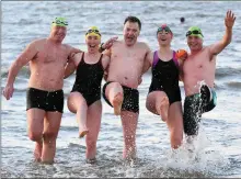  ??  ?? All smiles at Fenit on Sunday as swimmers took part in the charity ‘Polar Plunge’ event.