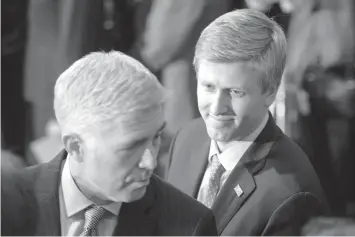  ??  ?? Nick Ayers, right, listens as Supreme Court Associate Justice Neil Gorsuch waits for the arrival of the casket for former President George H.W. Bush to lie in State at the Capitol on Capitol Hill in Washington. President Donald Trump's top pick to replace John Kelly as chief of staff, Nick Ayers, is no longer expected to fill that role, according to a White House official. The official says that Trump and Ayers could not agree on Ayers' length of service. ASSOCIATED PRESS