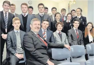  ??  ?? ●● Dr
Ian
Bratt with pupils from King’s Sixth Form