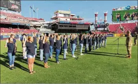  ?? U.S. AIR FORCE PHOTOS/R.J. ORIEZ ?? Participan­ts in the U.S. Air Force’s Delayed Entry Program take the oath of enlistment Aug. 9 in a pregame ceremony presided over by Col. Thomas Sherman, 88th Air Base Wing and installati­on commander, at Great American Ball Park, Cincinnati, prior to a Reds-Cubs baseball game. The U.S. Air Force Band of Flight and the Wright-Patterson AFB Honor Guard also took part in pregame activities.