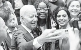  ?? ?? US President Joe Biden takes a selfie with students follwing the 25th anniversar­y of the Belfast/Good Friday Agreement, at Ulster University, Belfast, Northern Ireland April 12, 2023. Image Credit: REUTERS