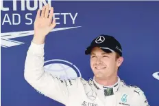  ?? — AFP ?? First placed Mercedes AMG Petronas F1 Team’s Nico Rosberg celebrates his pole position after the qualifying session of the Hungary GP in Budapest.