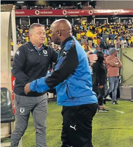  ?? Picture: GALLO IMAGES/LEFTY SHIVAMBU ?? BATTLING ON FRONTS: Sundowns coach Pitso Mosimane, right, seen with Wits’ Gavin Hunt, says his men are ready to dig deep for African and domestic glory.