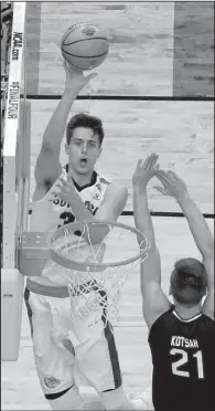  ?? AP/DAVID J. PHILLIP ?? Gonzaga forward Zach Collins shoots over South Carolina forward Maik Kotsar. Collins finished with 14 points, 13 rebounds and 6 blocks for the Bulldogs.