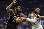  ?? KARL MONDON — BAY AREA NEWS GROUP FILE ?? The Los Angeles Lakers' D'angelo Russell drives on the Golden State Warriors' Andrew Wiggins in the first quarter on Feb. 11, at Chase Center in San Francisco.