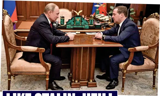  ??  ?? Face off: Vladimir Putin with outgoing prime minister Dmitry Medvedev yesterday