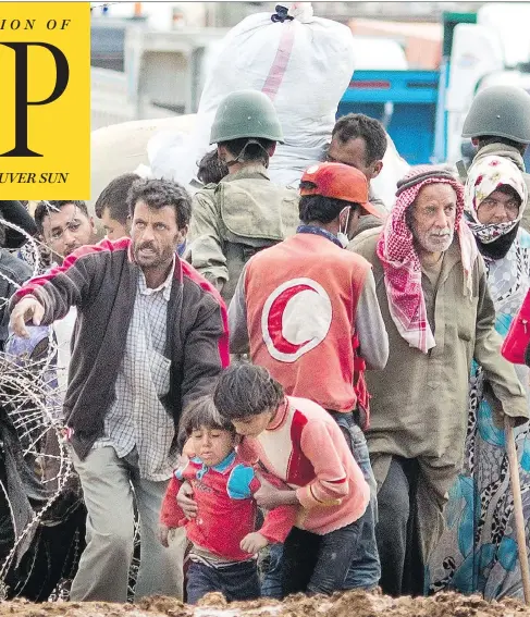  ?? CARSTEN KOALL/GETTY IMAGES ?? Syrian refugees wait to enter Turkey in Yumurtalik in 2014. Today, Turkey is moving toward “a medium- to long-term integratio­n policy” for them.