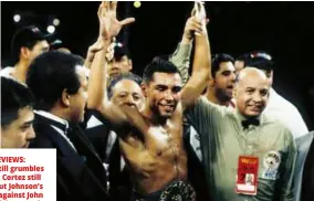  ??  ?? MIXED REVIEWS: Hatton [left] still grumbles about Cortez; Cortez still grumbles about Johnson’s performanc­e against John Ruiz in a dreadful excuse for D KHDY\ZHLJKW WLWOH ԴJKW
[right]; Cortez grapples with Barrera [left] and raises the arm of De La Hoya [above, right]