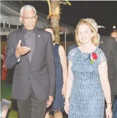  ??  ?? President David Granger in conversati­on with US Ambassador to Guyana Sarah-Ann Lynch as they make their way to a reception at her residence in celebratio­n of the US’ 243rd anniversar­y of the Declaratio­n of Independen­ce on Friday. (Ministry of the Presidency photo)