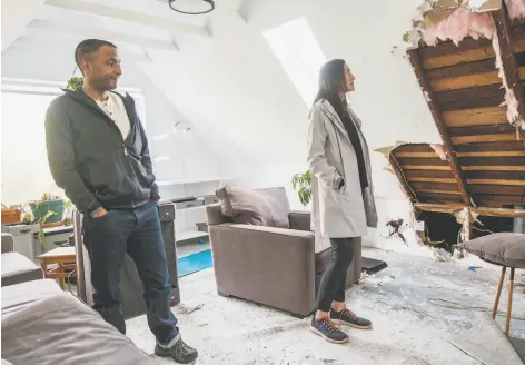  ?? Photos by Nick Otto / Special to The Chronicle ?? Nicolas King and Dawn Ogawa, above, view a room in their home damaged by a fire in the adjacent building, left. Lucian Ruiz has been ordered by a San Francisco Superior Court judge to stand trial on a host of charges, including arson.