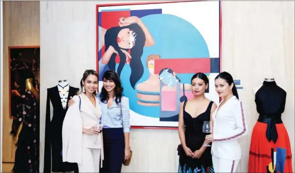  ?? SUPPLIED ?? Adana Mam Legros (second from left) and artist Tytaart (second from right) recently launched their joint exhibition at Rosewood Phnom Penh.