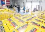  ?? STEPHEN M. DOWELL/STAFF PHOTOGRAPH­ER ?? A popular item with Puerto Ricans, Medalla beer, awaits distributi­on at Titan Products in Orlando.