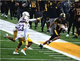  ?? (Pine Bluff Commercial/I.C. Murrell) ?? UAPB wide receiver Tyrin Ralph gains a first down as Prairie View defenders, including Jaylen Harris (23), force him out of bounds after a first-quarter reception.