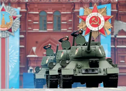  ?? AP ?? Soviet World War II vintage T-34 tanks roll in Red Square during the Victory Day military parade in Moscow.