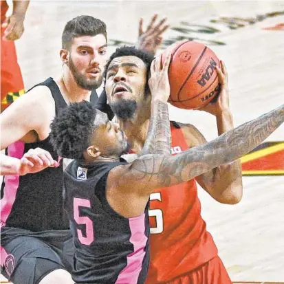  ?? KENNETH K. LAM/BALTIMORE SUN PHOTOS ?? Maryland’s Eric Ayala, right, is fouled by Penn State’s Jamari Wheeler (5) during Sunday night’s game.