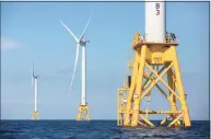  ?? Michael Dwyer / Associated Press ?? In this 2016 photo, three of Deepwater Wind’s turbines stand in the water off Block Island, R.I. A huge wind farm off the Massachuse­tts coast is edging closer to federal approval.