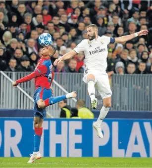  ?? Picture: REUTERS/TATYANA MAKEYEVA ?? EYE ON THE BALL: Real Madrid’s Karim Benzema goes airborne, as CSKA Moscow’s Rodrigo Becao seems to do a balancing act in their clash on Tuesday.