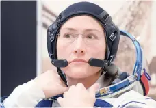  ?? — AFP ?? In this file photo taken on March 14, 2019 Christina Hammock Koch looks on as her spacesuit is tested prior to the launch on board the Soyuz MS-12 spacecraft from the Russian-leased Baikonur cosmodrome in Kazakhstan.