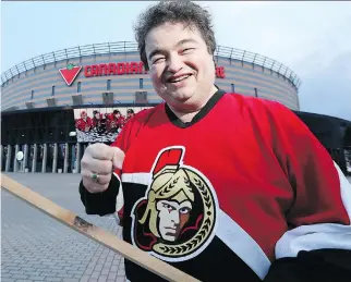  ??  JULIE OLIVER /OTTAWA CITIZEN ?? Councillor Rick Chiarelli was at Canadian Tire Centre Monday trying to undo the curse some say he put on the Senators when he introduced a motion last week to open Sens Mile early.