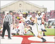  ?? Eric Bronson / University of Michigan Athletics ?? Newtown native Ben Mason rushed for a pair of touchdowns as a freshman at the University of Michigan.