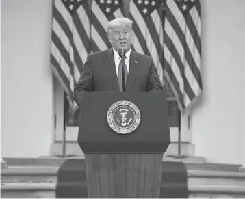  ?? EVAN VUCCI/AP ?? President Donald Trump discusses the work on developing a coronaviru­s vaccine in the Rose Garden on Friday.