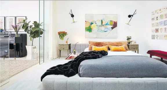  ?? PHOTOS: RYAN DAUSCH/JDK INTERIORS ?? It takes a careful touch, but homeowners can consider moving a piece of art they already own — such as this striking piece in a bedroom designed by Jenny Kirschner — from one room to another as a cost-free way of redecorati­ng their space for a...