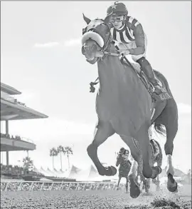  ?? Benoit Photo ?? FLAVIEN PRAT GUIDES Bellafina to an impressive victory in the Debutante at Del Mar. Prat later won the John C. Mabee Stakes on Vasilika.