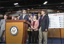  ?? J. SCOTT APPLEWHITE / ASSOCIATED PRESS ?? Speaker of the House Paul Ryan, R-Wis., speaks after the passage Thursday of a $1.2 trillion spending bill to fund the government at the Capitol in Washington with (from left) Rep. Hal Rogers, R-Ky.; Rep. Rodney Frelinghuy­sen, R-N.J., chairman of the...