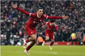  ?? Photograph: Tim Keeton/EPA ?? Trent Alexander-Arnold celebrates after scoring Liverpool’s late winner against Fulham.