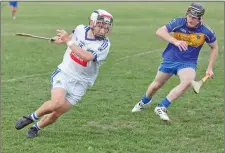  ??  ?? Éire Ógs Eoin Dorgan tries to get away from Carnew’s Aaron Kinsella during the SHC clash at Dunbur Park. s