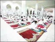  ??  ?? Muslim pilgrims pray inside the Namira Mosque in Arafat as they keep social distancing to protect themselves against coronaviru­s during the annual Hajj pilgrimage near the Holy City of Makkah, Saudi Arabia on July 30. This year’s Hajj was dramatical­ly scaled down from 2.5 million pilgrims to as few as 1,000 due to the coronaviru­s pandemic. (AP)