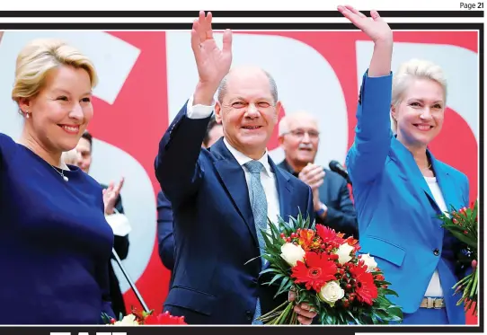  ?? ?? Contender for the top job: Social Democrat candidate Olaf Scholz, centre, yesterday