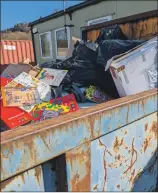  ?? Photograph: Alison Craig. ?? Dumped Gaelic books in a skip outside a former Argyll and Bute Council education office in Dalintart Road.