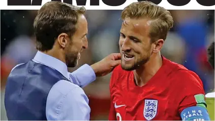  ??  ?? Hug with Harry: England manager Southgate greets two-goal striker Kane in the wake of victory