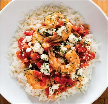  ??  ?? Greek-Style Shrimp with Tomatoes and Feta. This recipe appears in the cookbook “Complete Mediterran­ean.”