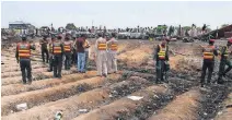  ??  ?? Pakistani rescue workers gather at the site of an oil tanker explosion Sunday at a highway near Bahawalpur, Pakistan. Officials announced that at least 153 people had died from the explosion.