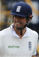  ?? GRAHAM CHADWICK ?? Grinning in the rain: Cook is happy as play ends