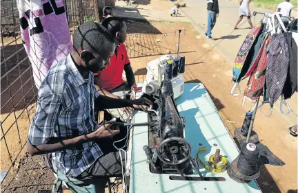  ?? / VELI NHLAPO ?? Soweto-based dressmaker Ali Sambo switched to making face masks during the lockdown.
