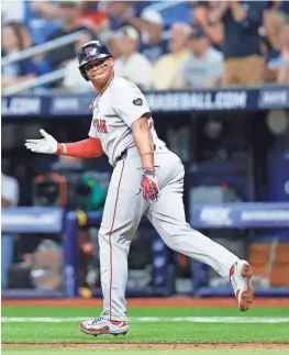  ?? DOUGLAS P. DEFELICE/GETTY IMAGES ?? Rafael Devers of the Red Sox reacts after hitting a two-run home run during the third inning against the Rays at Tropicana Field on Monday.