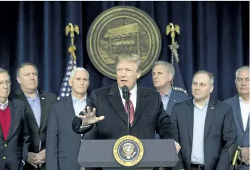  ?? ANDREW HARNIK/AP PHOTO ?? U.S. President Donald Trump, centre, accompanie­d by from left, Senate Majority Leader Mitch McConnell of Ky., VicePresid­ent Mike Pence, House Majority Leader Kevin McCarthy of Calif., House Majority Whip Steve Scalise, R-La., Secretary of State Rex...