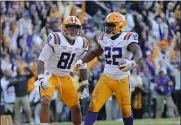  ?? GERALD HERBERT - THE ASSOCIATED PRESS ?? LSU running back Clyde Edwards-Helaire (22) celebrates his touchdown with tight end Thaddeus Moss (81) in the second half of an NCAA college football game against Auburn in Baton Rouge, La., Saturday, Oct. 26, 2019. LSU won 23-20.