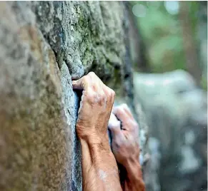  ??  ?? Bouldering - there’s no rope or harness; just the climber, a dusting of climbing chalk and an uneven rock face waiting to be scaled.